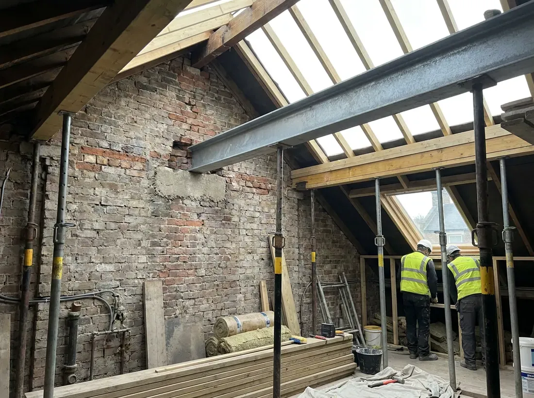 A steel beam bearing onto a padstone in a loft party wall