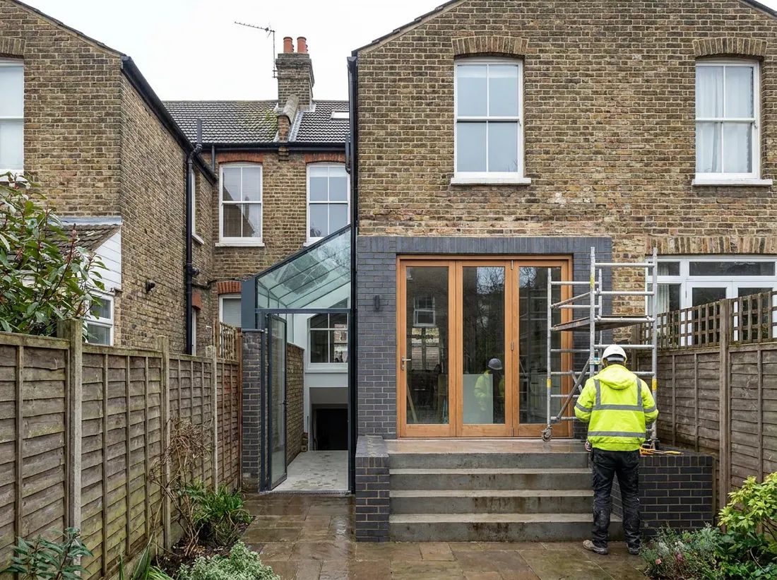 A completed single-storey rear extension with sliding doors